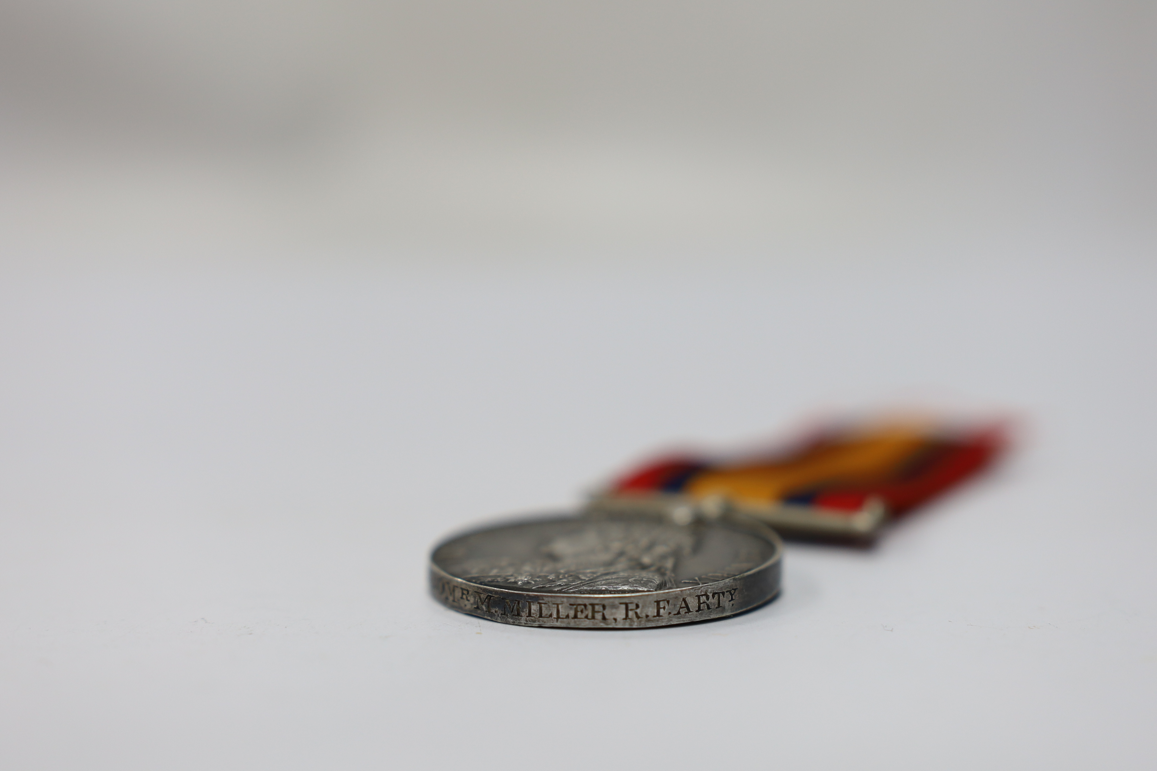 Assorted medals; two replica British North Borneo medals; Balaklava medallion; bronze GV medal; German China Campaign medal; bronze NRA medallion, unnamed